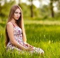 Beautiful young blonde woman on the meadow Royalty Free Stock Photo