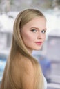 Beautiful young blonde woman with perfect skin and long light blond hair Royalty Free Stock Photo