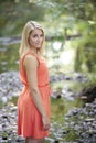 Stunning young blonde woman poses outside Royalty Free Stock Photo