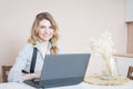 Beautiful young blonde woman using laptop Royalty Free Stock Photo