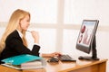 Beautiful young blonde woman working on computer in her office Royalty Free Stock Photo