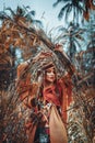 Beautiful young boho gypsy style woman outdoors