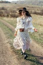 Beautiful young boho woman walking on nature Royalty Free Stock Photo