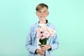 Young boy with eustoma flowers Royalty Free Stock Photo