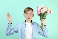 Young boy with eustoma flowers Royalty Free Stock Photo