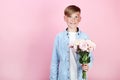 Young boy with eustoma flowers Royalty Free Stock Photo