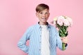 Young boy with eustoma flowers Royalty Free Stock Photo