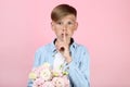 Young boy with eustoma flowers Royalty Free Stock Photo