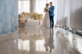 Beautiful and young bride and groom in the boudoir room