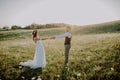 Beautiful bride and groom at sunset in green nature. Royalty Free Stock Photo