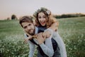 Beautiful bride and groom at sunset in green nature. Royalty Free Stock Photo