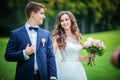 Beautiful young bride and groom in park Royalty Free Stock Photo