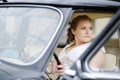 Beautiful young bride portrait in a car Royalty Free Stock Photo