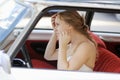 Beautiful young bride portrait in a wedding car Royalty Free Stock Photo