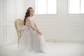 Beautiful young bride sitting on a chair Royalty Free Stock Photo
