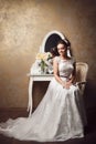 Beautiful young bride sitting near mirror Royalty Free Stock Photo