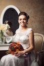 Beautiful young bride sitting near mirror Royalty Free Stock Photo