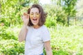 Happy girl smiling. Beauty portrait young happy positive laughing brunette woman in trendy yellow sunglasses on park or Royalty Free Stock Photo