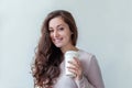 Beautiful young brunete woman with take away paper coffee cup isolated on white background. Happy smiling girl having lunch break Royalty Free Stock Photo