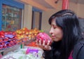 Beautiful young brunette girl in the fruit market Royalty Free Stock Photo