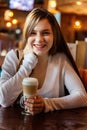 Young woman sitting in cafe Royalty Free Stock Photo