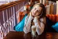 Young woman sitting in cafe Royalty Free Stock Photo