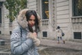 Beautiful young brunette posing in the city streets