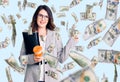 Beautiful young brunette woman holding business folder and drinking coffee smiling happy pointing with hand and finger to the side Royalty Free Stock Photo