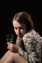 Beautiful young brunette woman holding a glass of white wine Royalty Free Stock Photo