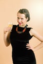 Beautiful young brunette woman holding a glass of white wine Royalty Free Stock Photo