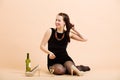 Beautiful young brunette woman holding a glass of white wine Royalty Free Stock Photo