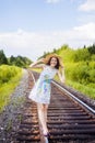 Beautiful young brunette woman on the meadow Royalty Free Stock Photo