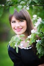 Beautiful young brunette woman on the meadow with white flowers Royalty Free Stock Photo