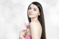 Beautiful young brunette woman with pink lilly Royalty Free Stock Photo