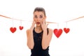 Beautiful young brunette woman with red heart in hands posing isolated on white background. Saint Valentine`s day Royalty Free Stock Photo