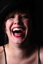 Beautiful young brunette woman with red lipstick laughing Royalty Free Stock Photo