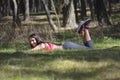 Beautiful young brunette woman relaxing in the forest. Royalty Free Stock Photo