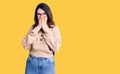 Beautiful young brunette woman wearing casual clothes and glasses laughing and embarrassed giggle covering mouth with hands, Royalty Free Stock Photo