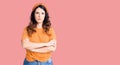 Beautiful young brunette woman wearing casual clothes skeptic and nervous, disapproving expression on face with crossed arms Royalty Free Stock Photo