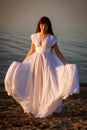young woman in white dress on the beach Royalty Free Stock Photo