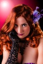 Beautiful young burlesque showgirl with piercing eyes. Royalty Free Stock Photo