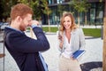 Beautiful young business people laughing in front of a building. colleagues, break, spontaneous