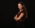 Beautiful young business smiling woman thinking and looking happy with folded arms in burgundy blouse and with red lipstick on Royalty Free Stock Photo