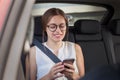 Beautiful young business woman in the car talking on phone Royalty Free Stock Photo