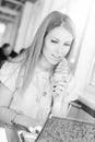 Beautiful young business woman eating ice cream at Royalty Free Stock Photo
