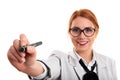 Beautiful young business woman pointing at a virtual point with a pen Royalty Free Stock Photo