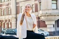 Beautiful young business woman talking on cell phone in city Royalty Free Stock Photo