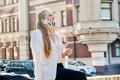 Beautiful young business woman talking on cell phone in city Royalty Free Stock Photo