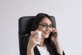 beautiful young Business woman talking on her mobile phone in the office and holding a cup of coffee. Business Concept. Lifestyle Royalty Free Stock Photo