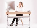 Beautiful young business woman talks on the phone in her office isolated in white background Royalty Free Stock Photo